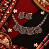 Multicolor oxidised elephant motif necklace set for women with colourful stones, hanging ghungroo and matching traditional jhumka earrings.