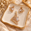 Rose gold American diamond pendant set featuring an angular open lattice design, square clear centre stones and matching geometric earrings.