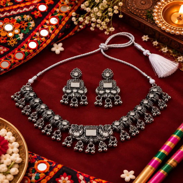 Geometric oxidised necklace set with ornate silver detailing, hanging beads and matching earrings
