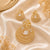Luxury gold American Diamond pendant set without chain featuring a pear-cut centre stone with matching designer earrings in a premium gold finish.