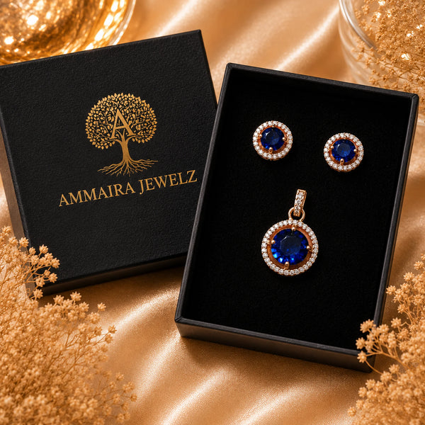 Imperial sapphire blue halo pendant with matching American diamond stud earrings in premium gold-tone finish, pendant set without chain.