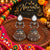 Two-tone oxidized mirror-work jhumka earrings for women featuring teardrop-shaped mirror accents, intricate traditional detailing and festive Navratri styling.