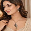 Luxury peacock pearl pendant set with American diamonds and matching designer earrings in black rhodium and rose gold finish.