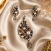 Luxury peacock pearl pendant set with American diamonds and matching designer earrings in black rhodium and rose gold finish.