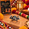 Antique oxidised silver alloy adjustable statement finger ring featuring twin peacock motifs and a beaded floral cluster.