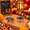 Antique oxidised silver alloy adjustable statement finger ring featuring twin peacock motifs and a beaded floral cluster.