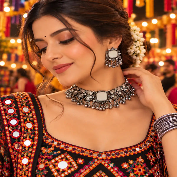 Mirrorwork oxidised silver choker set with intricate motifs, dangling beads and matching earrings