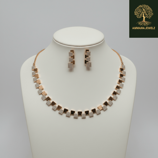 Modern rose gold necklace set with alternating square geometric motifs and matching stud earrings, displayed on a satin background, showcasing minimal luxury jewellery design.