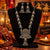 Statement two tone silver and gold oxidized necklace with peacock-inspired pendant, jhumka drop and matching long jhumka earrings for women.