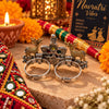 Two-tone fusion oxidised adjustable double-finger ring featuring golden deer motifs, multicolor center stones, and ghungroo drops.
