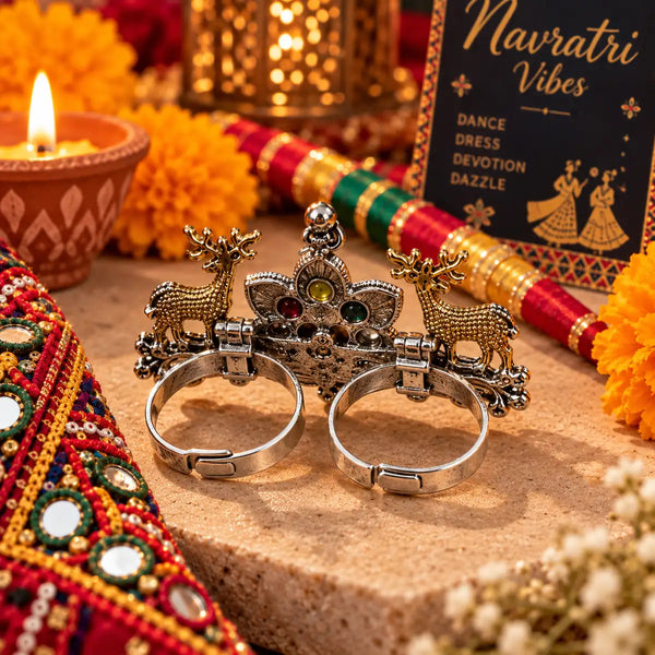 Two-tone fusion oxidised adjustable double-finger ring featuring golden deer motifs, multicolor center stones, and ghungroo drops.