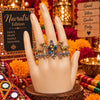 Two-tone fusion oxidised adjustable double-finger ring featuring golden deer motifs, multicolor center stones, and ghungroo drops.