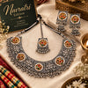 Handcrafted dual-tone oxidised choker necklace set for women with multicolor stones, jhumka earrings, and matching maangtikka.