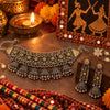 Statement two tone silver and gold oxidized choker necklace with jhumka drops and matching long jhumka earrings for women.