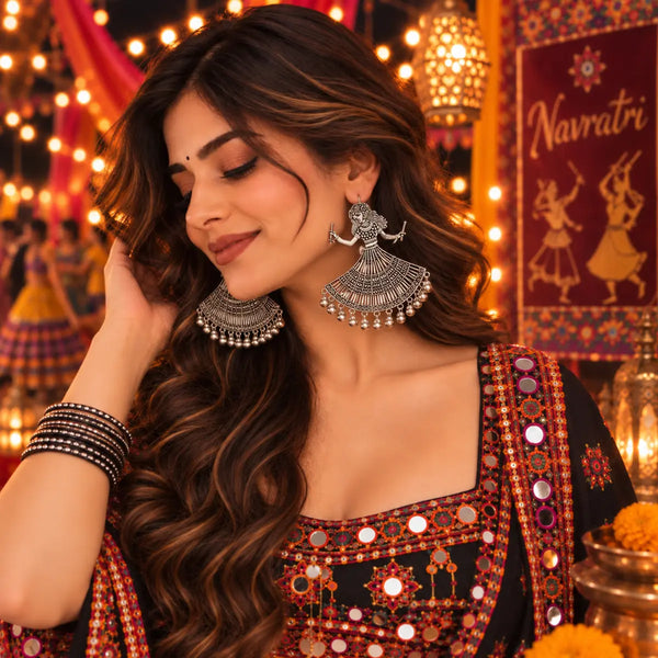 Oxidized German silver mirror work dancing woman dangler earrings for women with intricate traditional patterns and festive Navratri styling.