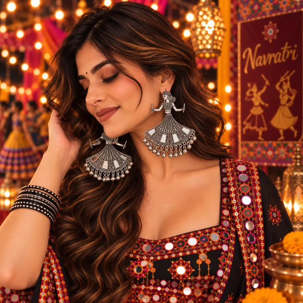 Oxidized German silver mirror work dancing woman dangler earrings for women, featuring intricate traditional design and festive Navratri styling.