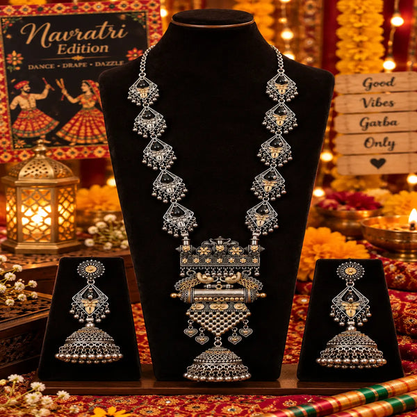 Royal peacock statement long necklace set for women with antique silver and gold-tone detailing, intricate pendant and matching jhumka earrings by Ammaira Jewelz.