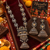 Royal peacock statement long necklace set for women with antique silver and gold-tone detailing, intricate pendant and matching jhumka earrings by Ammaira Jewelz.