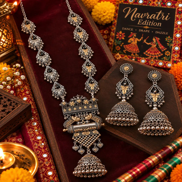 Royal peacock statement long necklace set for women with antique silver and gold-tone detailing, intricate pendant and matching jhumka earrings by Ammaira Jewelz.