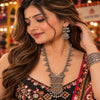 Two tone fusion oxidised Navratri necklace set with intricate antique-inspired pendant, metallic bead detailing and matching statement earrings for women.