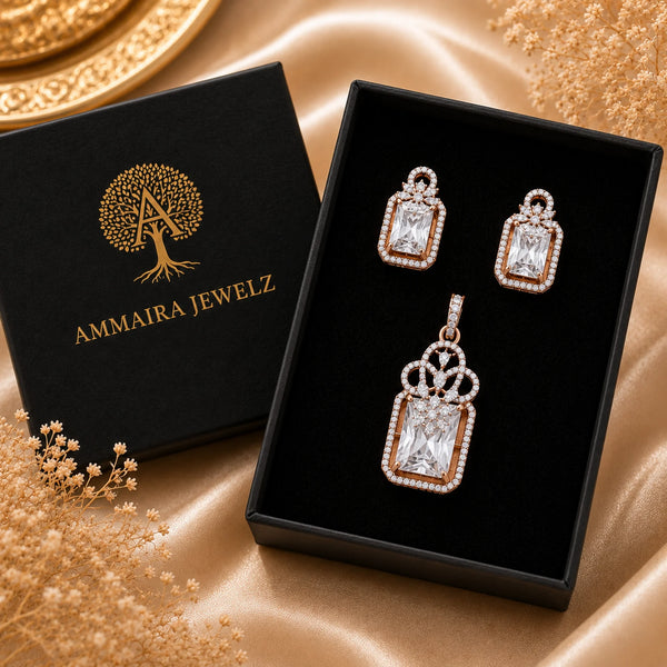 Regal Lumière rose gold American Diamond pendant set with matching earrings featuring radiant rectangular stones and halo detailing.