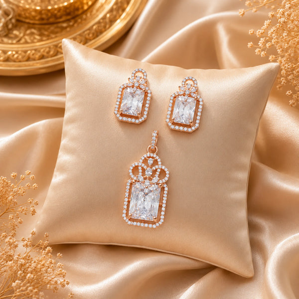 Regal Lumière rose gold American Diamond pendant set with matching earrings featuring radiant rectangular stones and halo detailing.