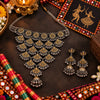 Statement two tone silver and gold choker necklace set with ghungroo details and matching long jhumka earrings for women.