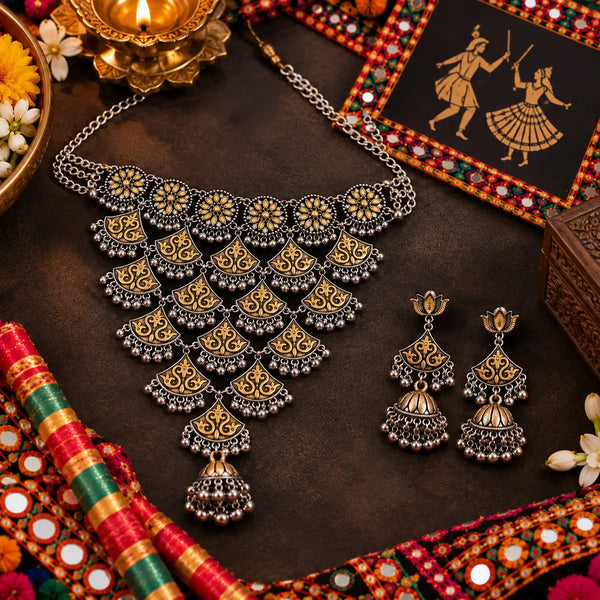 Statement two tone silver and gold choker necklace set with ghungroo details and matching long jhumka earrings for women.