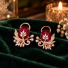 Rose gold floral statement earrings with oval centre stones, leaf motifs and sparkling zirconia detailing, available in ruby red, emerald green, blush pink and deep purple.