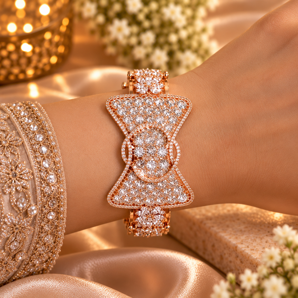 18K rose gold polished premium brass bracelet featuring a bow-inspired design with densely set clear zirconia stones and intricate sparkling borders.