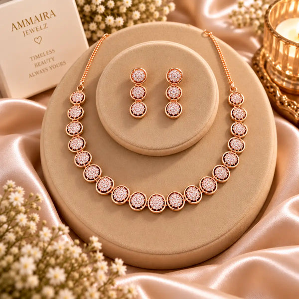 Rose gold Cubic Zirconia round link necklace set with matching three-tier round dangling earrings, featuring sparkling circular stone detailing.