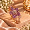 Rose gold premium brass floral cuff bracelet featuring red or purple zirconia petal clusters, clear marquise-shaped stones and sparkling detailing.