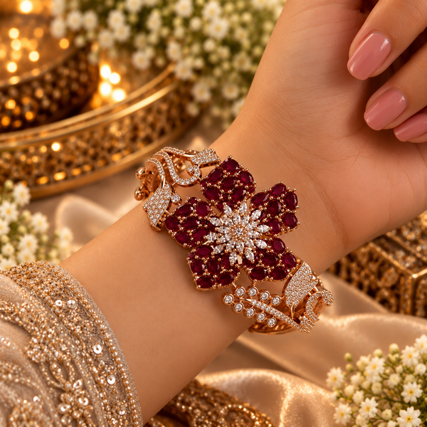 Rose gold premium brass floral cuff bracelet featuring red or purple zirconia petal clusters, clear marquise-shaped stones and sparkling detailing.