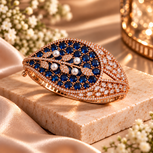 Rose gold premium brass cuff bracelet with coloured zirconia stones, pearl accents and clear stone detailing, available in red, green, champagne and blue variations.