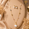 Elegant gold polish pearl mala set with crystal accents, designer beads, statement pearl pendant, and matching pearl earrings displayed on a model and luxury jewelry stand.