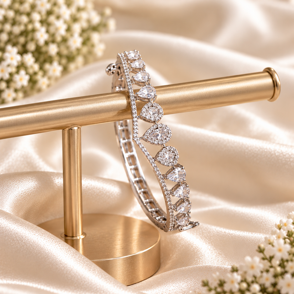 Silver-tone premium brass bracelet featuring clear zirconia teardrop stones and delicate sparkling accents