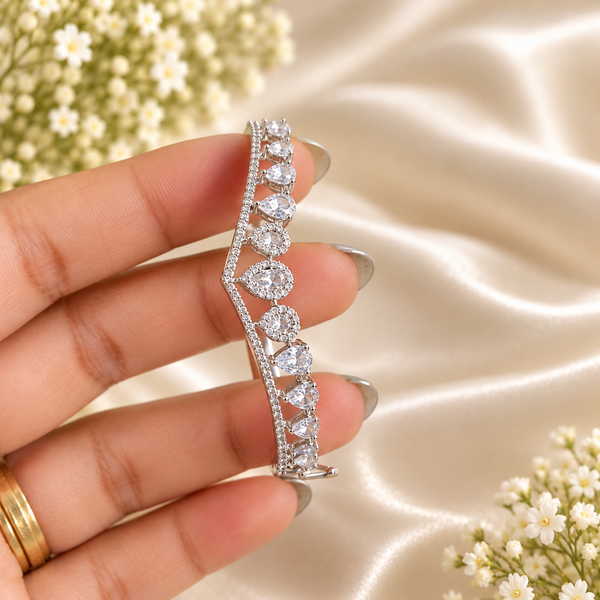Silver-tone premium brass bracelet featuring clear zirconia teardrop stones and delicate sparkling accents