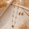 Elegant gold polish mala set with smoky grey and iridescent crystal beads paired with matching crystal earrings displayed on a model and luxury jewelry stand.