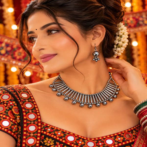 Tube-detail oxidised necklace set with silver-tone drops, black thread and matching earrings